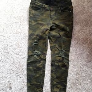 Distressed camo jeans